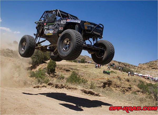 The Jimmys 4x4 built car of Derek West flies out of a wash during Saturdays final race.  The Colorado Springs track has become known for big air and bug jumps, a favorite for some drivers and most fans.